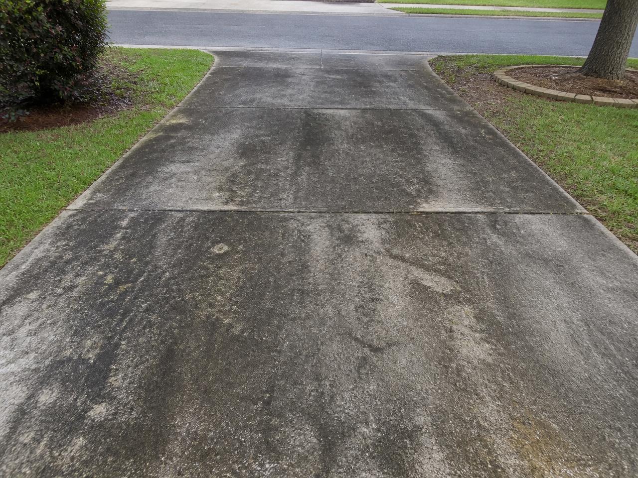 Residential concrete driveway before cleaning